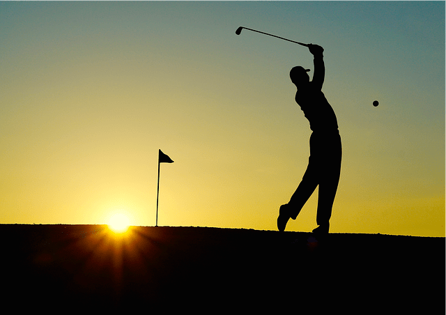 Silhouette Of A Golf Swing At Sunset